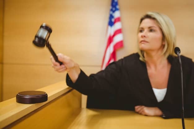 A gavel striking a sound block in a courtroom, with the US flag subtly blurred in the background. This image symbolizes legal action and the pursuit of justice in the context of trademark infringement.