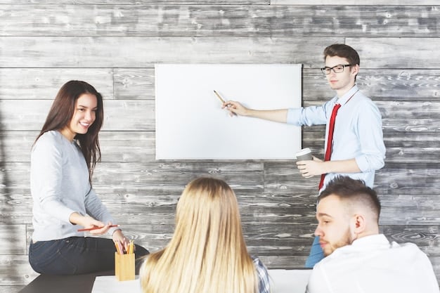 A group of employees participating in a training session. The trainer is explaining a concept on a whiteboard, while the participants are actively taking notes.