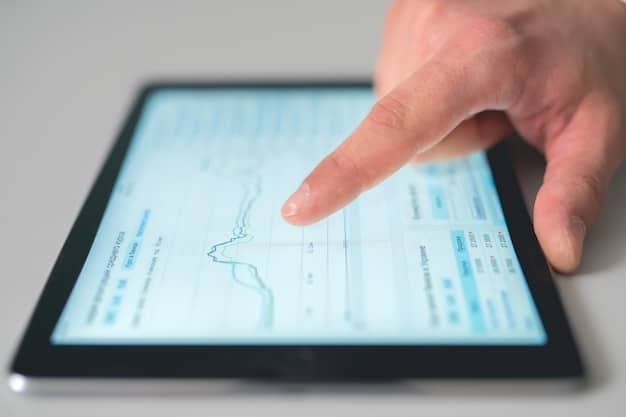 A close-up of a hand using inventory management software on a tablet, displaying real-time stock levels and reorder points.