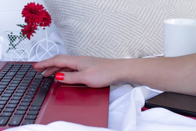 A close-up shot of a hand typing on a laptop keyboard, with a blurred background showing a security padlock symbol. The image represents cyber threats and the need for digital security measures in a business continuity plan.